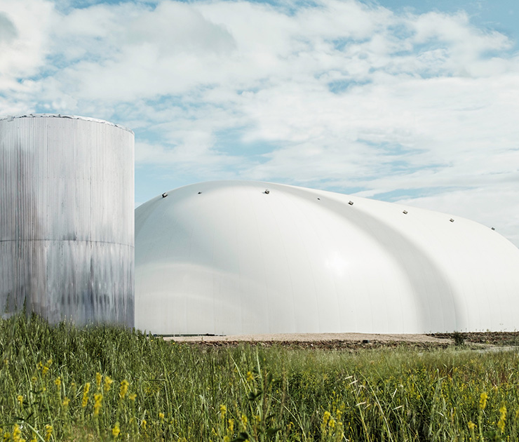 A large, white, elongated dome-shaped facility.