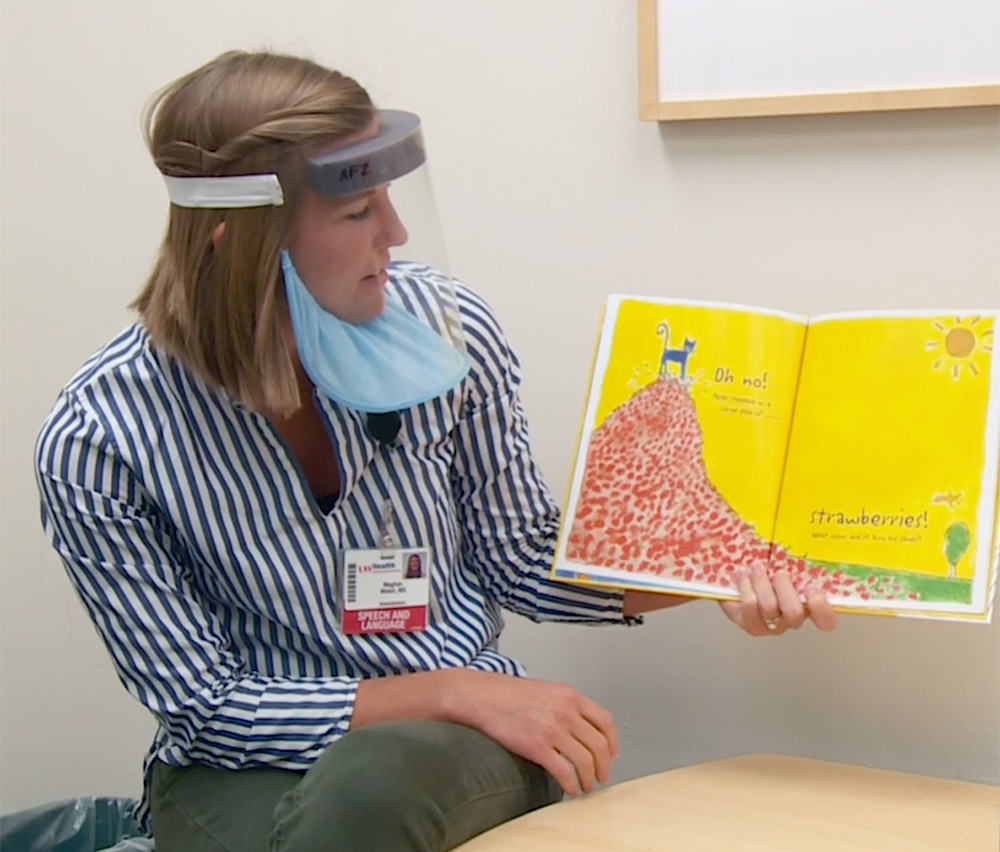Meghan Welsh, a UW Health speech therapist, uses the new Badger Shield+ during a therapy session.
